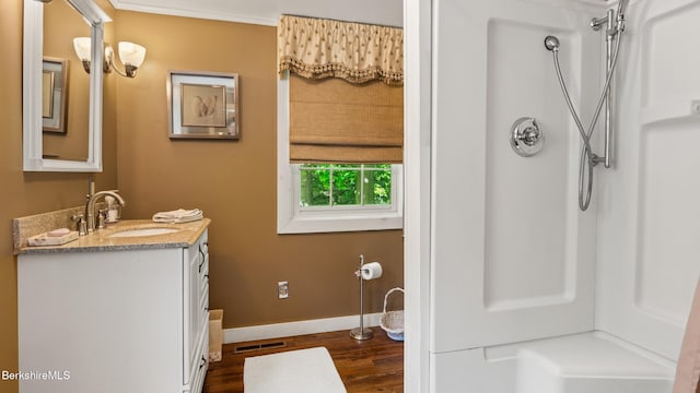 204 Cottage St, Great Barrington, MA 01236 - full bath with vanity, wood finished floors, baseboards, and a shower