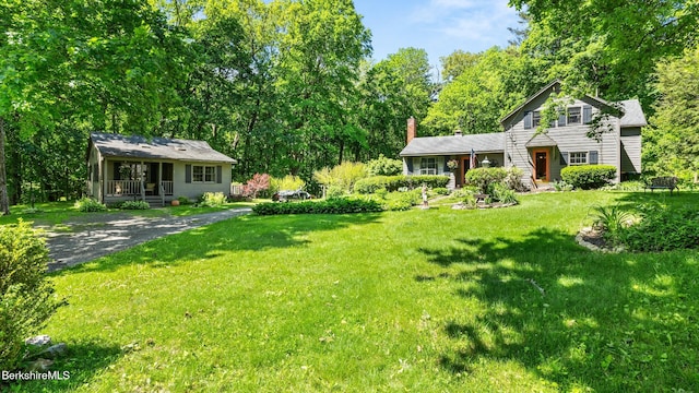 204 Cottage St, Great Barrington, MA 01236 - view of grassy yard with view of wooded area