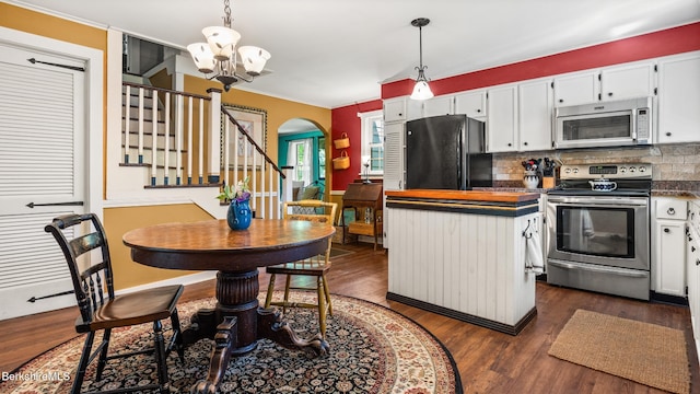 204 Cottage St, Great Barrington, MA 01236 - kitchen featuring white microwave, freestanding refrigerator, electric range, a chandelier, and decorative backsplash