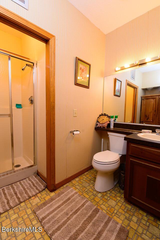 303 Lakeshore Dr, Sandisfield, MA 01255 - full bathroom with a shower stall and vanity