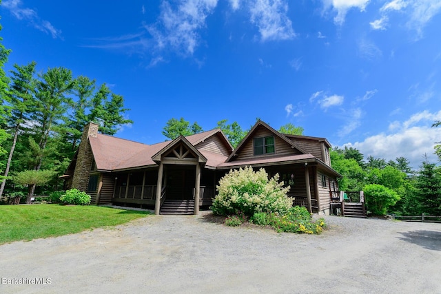 303 Lakeshore Dr, Sandisfield, MA 01255 - log cabin with a porch, dirt driveway, a front lawn, and a chimney