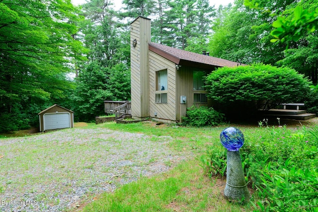 303 Lakeshore Dr, Sandisfield, MA 01255 - view of yard with an outdoor structure, a garage, and driveway