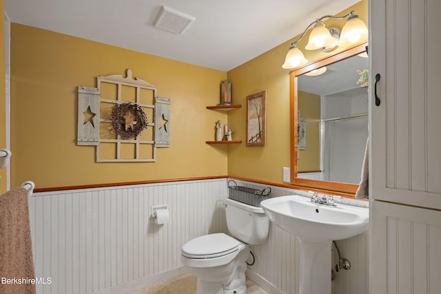 924 Henderson Rd, Williamstown, MA 01267 - bathroom with a wainscoted wall, toilet, and a sink