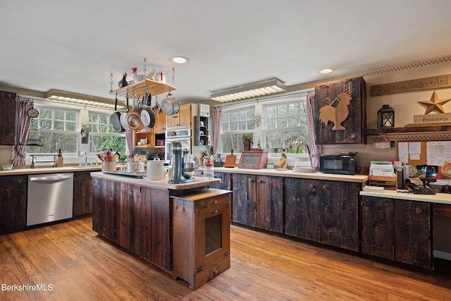 924 Henderson Rd, Williamstown, MA 01267 - kitchen with appliances with stainless steel finishes, dark brown cabinets, a center island, plenty of natural light, and recessed lighting