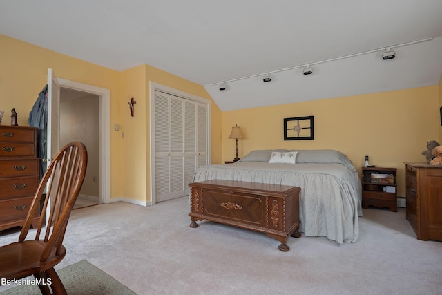 924 Henderson Rd, Williamstown, MA 01267 - bedroom with light colored carpet, a closet, rail lighting, baseboards, and vaulted ceiling