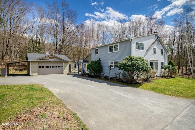 924 Henderson Rd, Williamstown, MA 01267 - view of front of house featuring driveway, a front yard, and a chimney