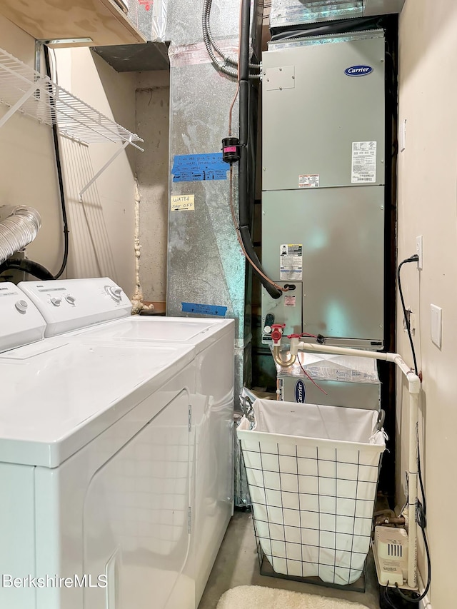 laundry area with independent washer and dryer