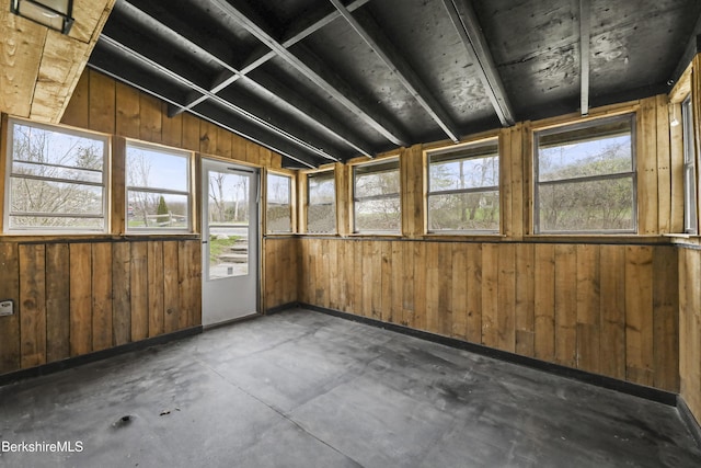unfurnished sunroom featuring a wealth of natural light