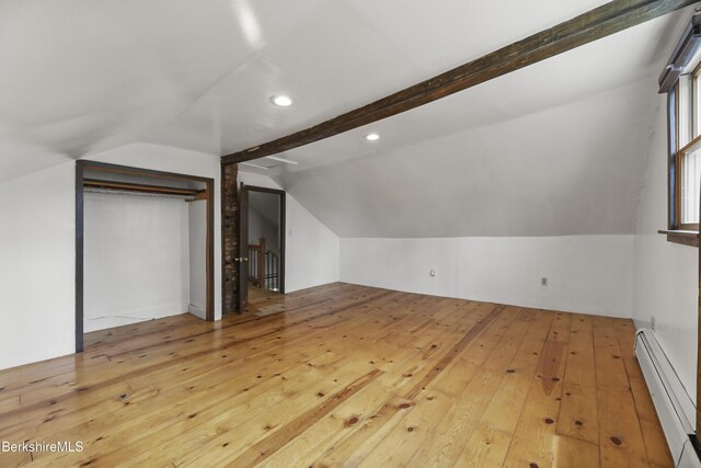 additional living space with a baseboard heating unit, recessed lighting, hardwood / wood-style flooring, and lofted ceiling