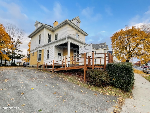 rear view of property with a deck