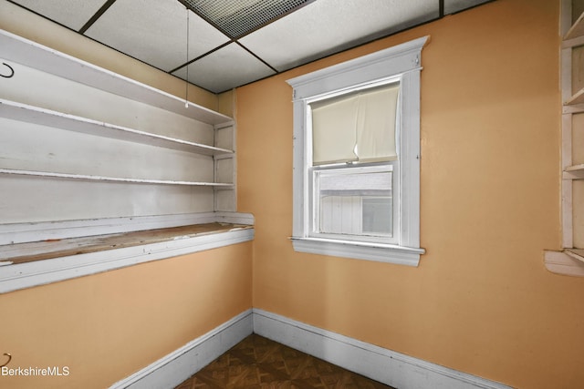 unfurnished dining area with baseboards