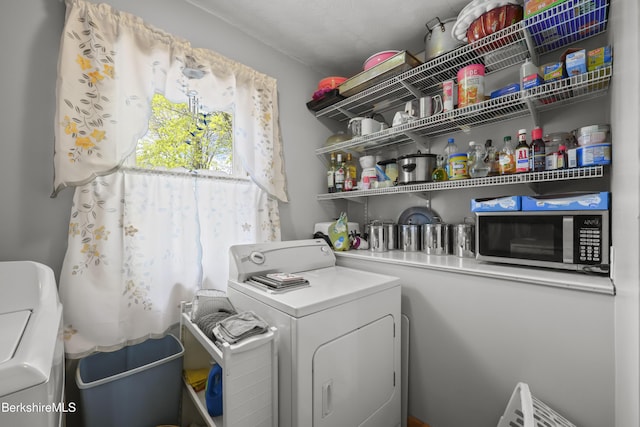 laundry area featuring laundry area and independent washer and dryer