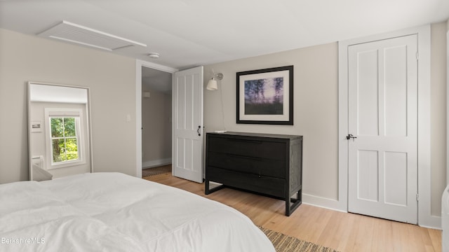 bedroom with hardwood / wood-style flooring