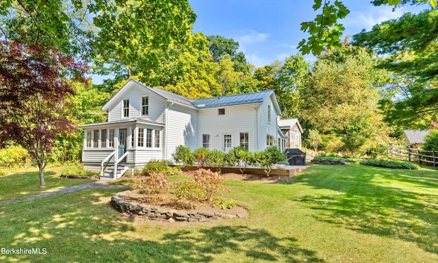 rear view of house with a lawn