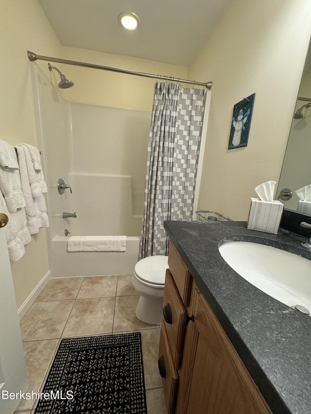 full bathroom featuring tile patterned flooring, vanity, toilet, and shower / tub combo with curtain