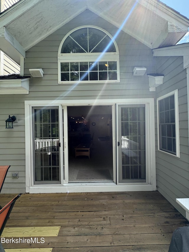 property entrance with a wooden deck