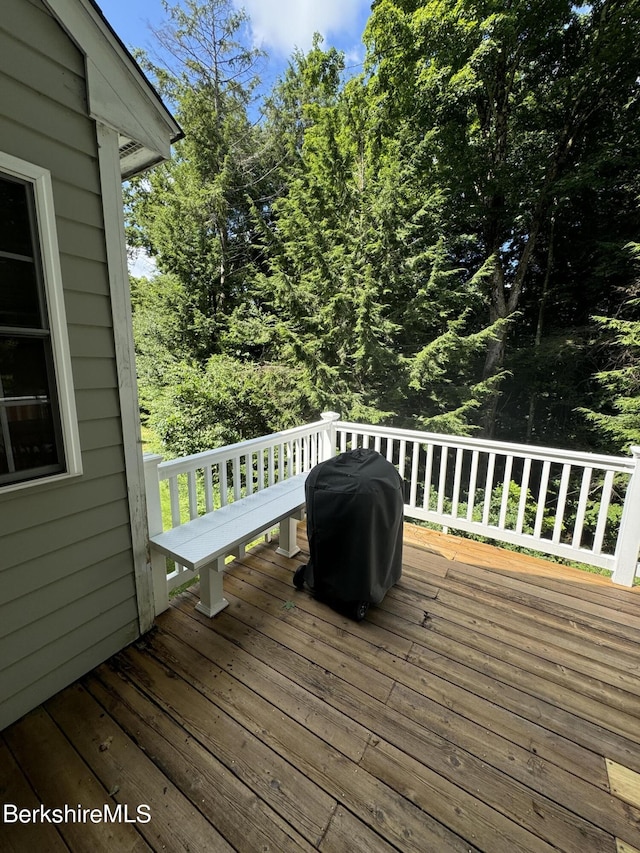 wooden terrace with grilling area