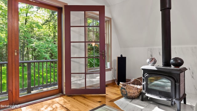 232 Giberson Rd, Sheffield, MA 01257 - entryway with lofted ceiling, a wood stove, and wood finished floors