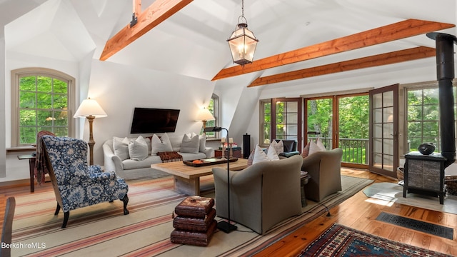 232 Giberson Rd, Sheffield, MA 01257 - living area with a wood stove, plenty of natural light, and wood finished floors