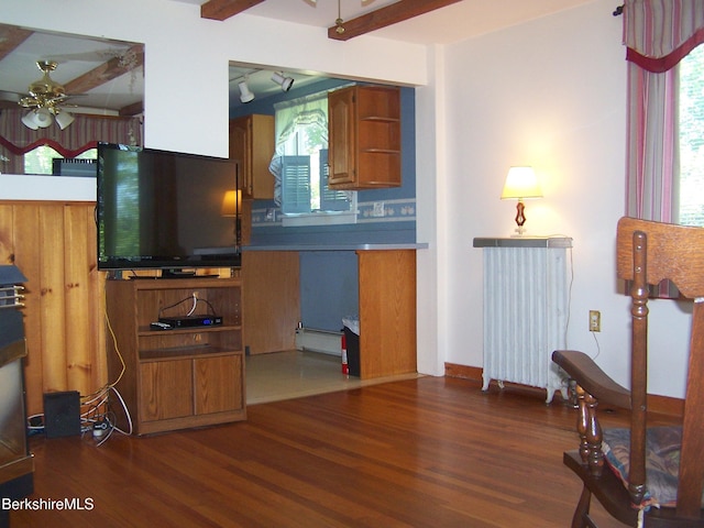 34 Bryant St, Pittsfield, MA 01201 - kitchen with ceiling fan, wood finished floors, baseboard heating, brown cabinetry, and beam ceiling