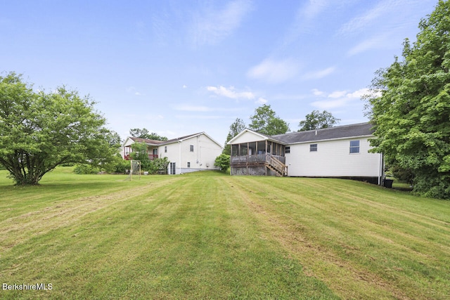 927 Holmes Rd, Pittsfield, MA 01201 - view of green lawn with a sunroom