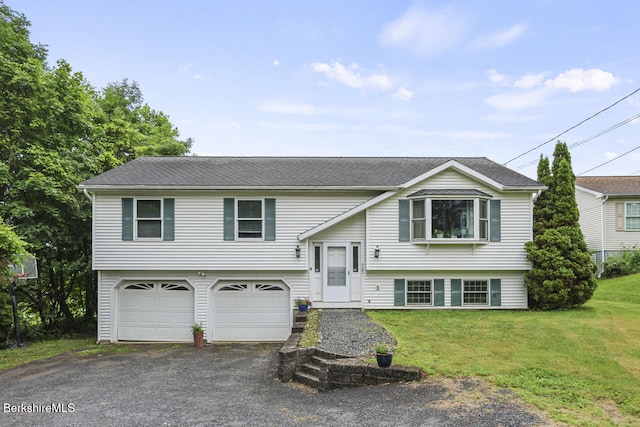 927 Holmes Rd, Pittsfield, MA 01201 - raised ranch with a garage, a front yard, driveway, and a shingled roof