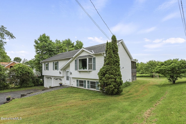 927 Holmes Rd, Pittsfield, MA 01201 - bi-level home featuring driveway, a garage, a front yard, and a shingled roof