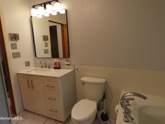 19 Grandview Ter, Adams, MA 01220 - bathroom featuring marble look tiles, toilet, and vanity