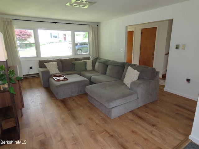 19 Grandview Ter, Adams, MA 01220 - living room featuring light wood finished floors and a baseboard heating unit