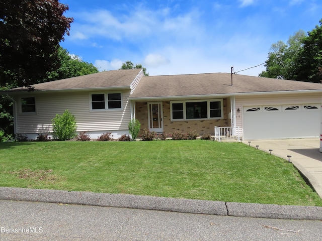 19 Grandview Ter, Adams, MA 01220 - view of front of home featuring concrete driveway, an attached garage, a front yard, and a shingled roof