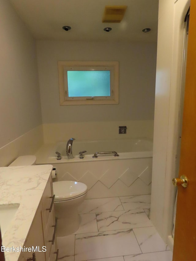 19 Grandview Ter, Adams, MA 01220 - bathroom featuring vanity, a bath, toilet, marble look tile flooring, and recessed lighting