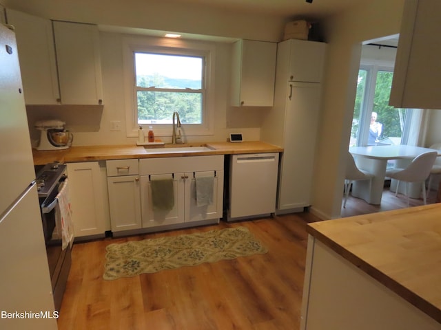 19 Grandview Ter, Adams, MA 01220 - kitchen featuring stainless steel dishwasher, a sink, wood counters, freestanding refrigerator, and range