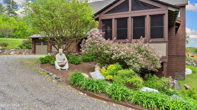 56 Crooked Hill Rd, Alford, MA 01230 - view of front of home with driveway, a garage, and a sunroom