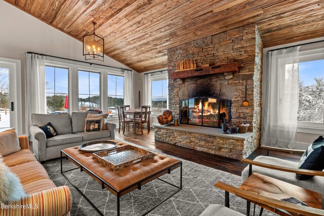 56 Crooked Hill Rd, Alford, MA 01230 - living room featuring vaulted ceiling, wood ceiling, healthy amount of natural light, hardwood / wood-style flooring, and a stone fireplace