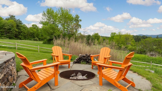 56 Crooked Hill Rd, Alford, MA 01230 - view of patio / terrace featuring an outdoor fire pit and a wooded view