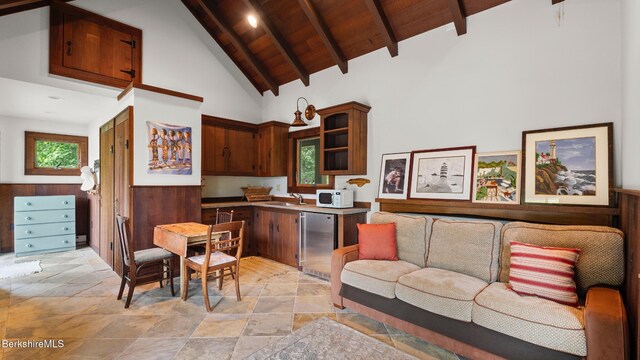 56 Crooked Hill Rd, Alford, MA 01230 - kitchen with light stone finish flooring, white microwave, high vaulted ceiling, wooden ceiling with exposed beams, and refrigerator