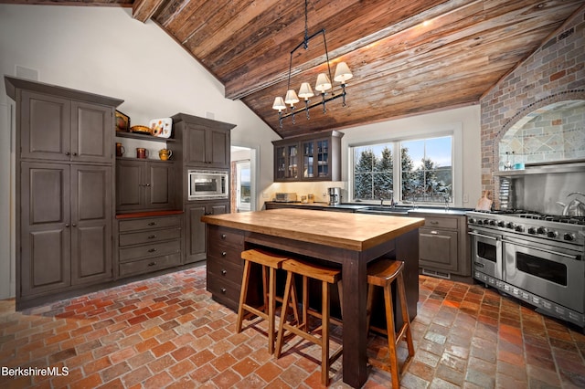 56 Crooked Hill Rd, Alford, MA 01230 - kitchen featuring butcher block countertops, open shelves, stainless steel appliances, wood ceiling, and brick flooring