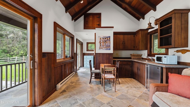 56 Crooked Hill Rd, Alford, MA 01230 - kitchen with a baseboard radiator, white microwave, light stone finish flooring, wood ceiling with exposed beams, and a wainscoted wall