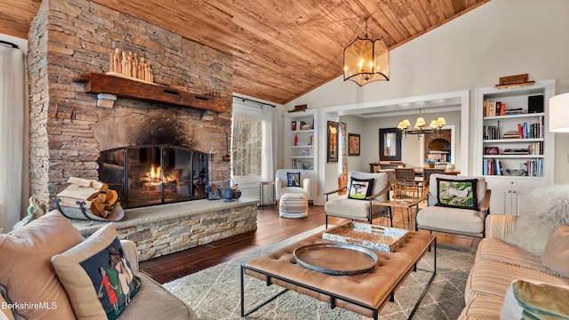 56 Crooked Hill Rd, Alford, MA 01230 - living area with wooden ceiling, a chandelier, built in features, wood finished floors, and a stone fireplace