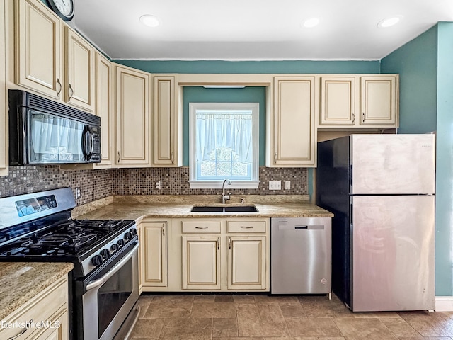432 Grange Hall Rd, Dalton, MA 01226 - kitchen with cream cabinets, stainless steel appliances, a sink, and recessed lighting