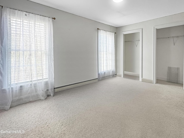 432 Grange Hall Rd, Dalton, MA 01226 - unfurnished bedroom with multiple closets, a baseboard radiator, carpet floors, and multiple windows