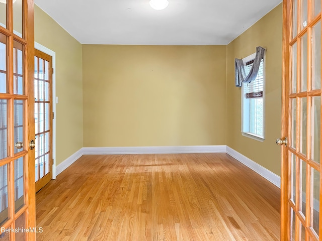 432 Grange Hall Rd, Dalton, MA 01226 - spare room with french doors, light wood-style floors, and baseboards