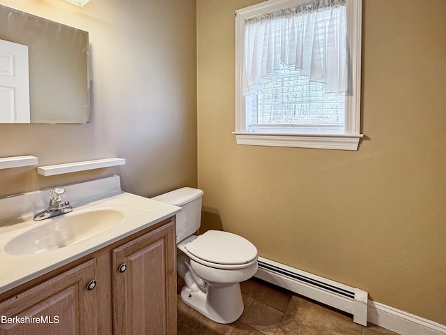 432 Grange Hall Rd, Dalton, MA 01226 - half bathroom featuring a baseboard heating unit, toilet, vanity, baseboards, and tile patterned flooring