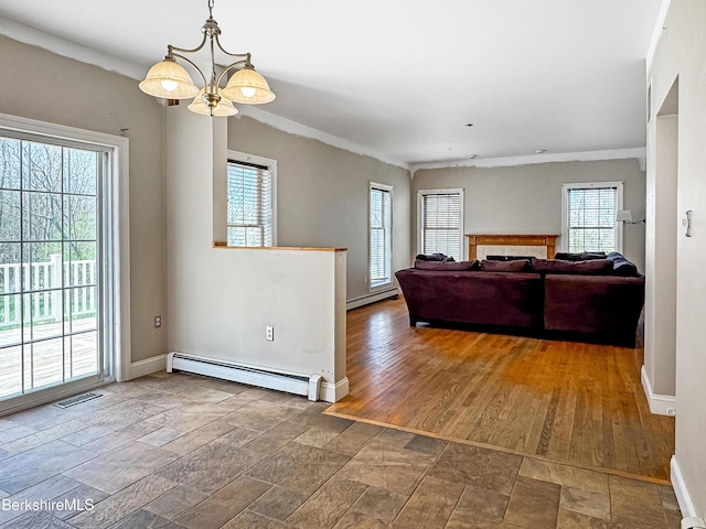 432 Grange Hall Rd, Dalton, MA 01226 - living area featuring a baseboard radiator, baseboards, stone tile floors, ornamental molding, and a tile fireplace