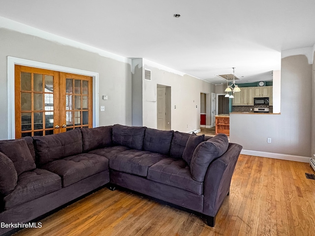 432 Grange Hall Rd, Dalton, MA 01226 - living area with light wood-style flooring, baseboards, and french doors