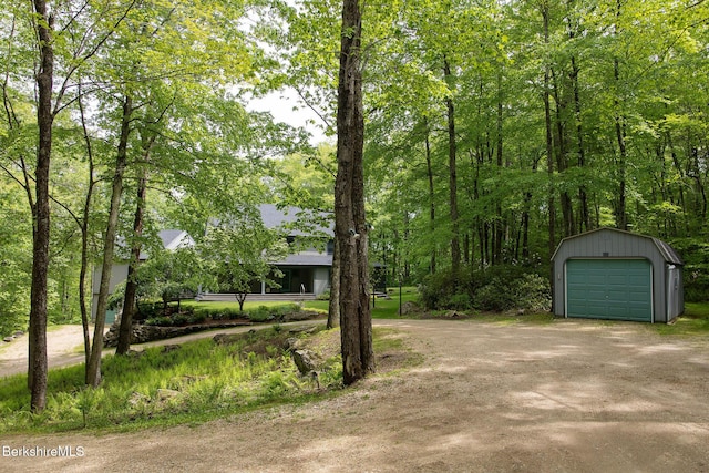 360 Brush Hill Rd, Sheffield, MA 01257 - view of yard featuring dirt driveway, a detached garage, and an outdoor structure