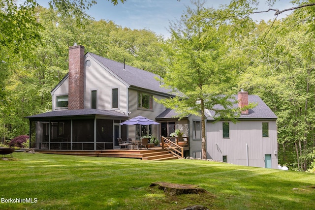 360 Brush Hill Rd, Sheffield, MA 01257 - rear view of house with a chimney, a sunroom, a deck, a lawn, and roof with shingles