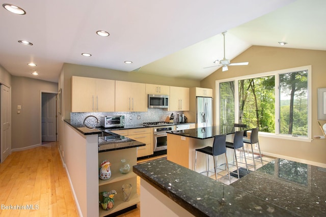 360 Brush Hill Rd, Sheffield, MA 01257 - kitchen with stainless steel appliances, tasteful backsplash, open shelves, baseboards, and a kitchen breakfast bar