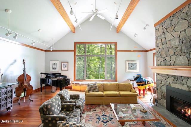 360 Brush Hill Rd, Sheffield, MA 01257 - living room with beam ceiling, a stone fireplace, wood finished floors, a ceiling fan, and high vaulted ceiling