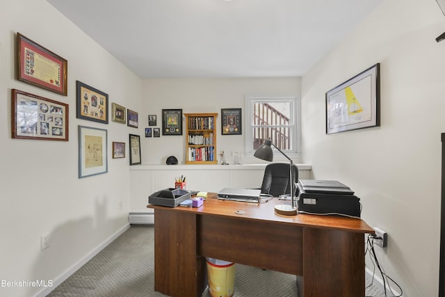 office area with baseboard heating and carpet